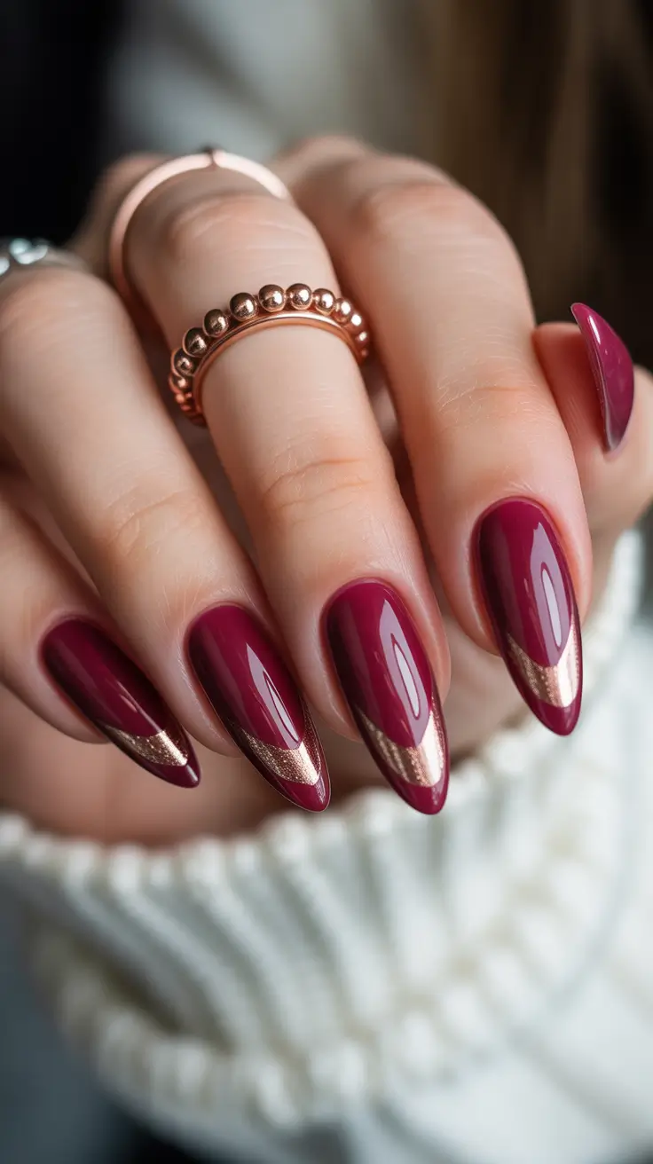 21 Elegant Almond Nails 2026 - Garnet Almonds With Metallic French Accent