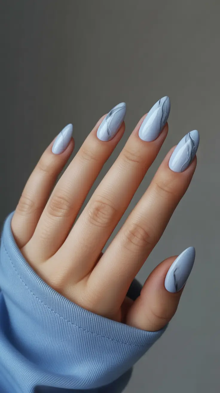 21 Elegant Almond Nails 2026 - Pale Ice-Blue Almonds With Marble Veining