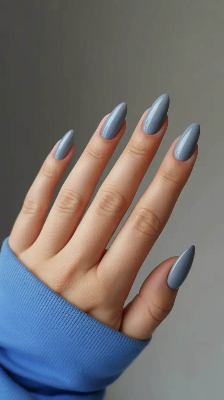 21 Elegant Almond Nails 2026 - Stormy Sky Blue Almonds With a Silky Shine