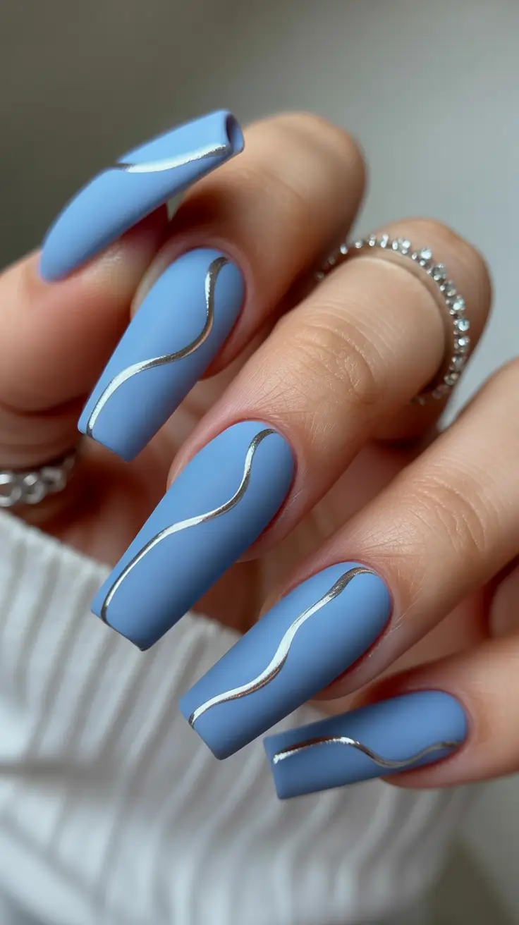21-new-coffin-nails-2026-Matte-Blue-Coffins-With-Metallic-Wave-Lines